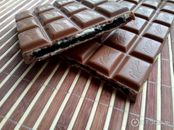 Шоколад молочный Milka Oreo с темным печеньем фото