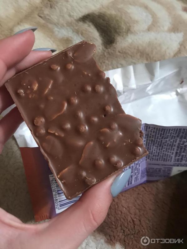 Шоколад молочный Milka Peanut & Crispy Caramel фото