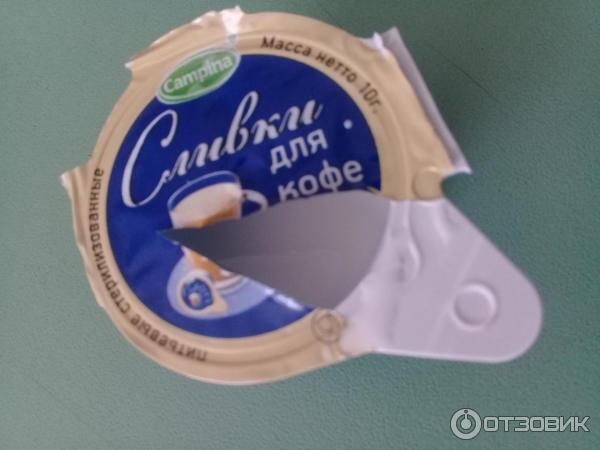 Сливки порционные Campina 10% фото